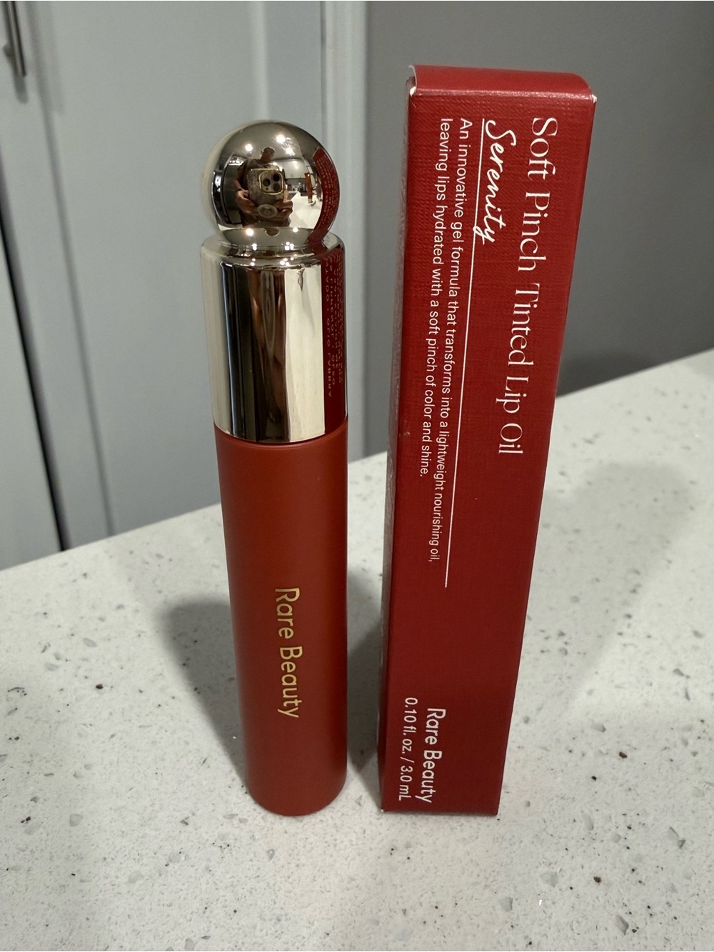 Rare Beauty Soft Pinch Tinted Lip Oil in Deep Coral-Red. Serenity color